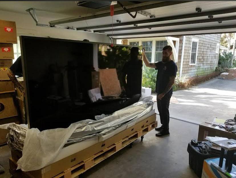 Movers 8 AV equipment movers carefully transporting theater and entertainment systems in Jacksonville, FL