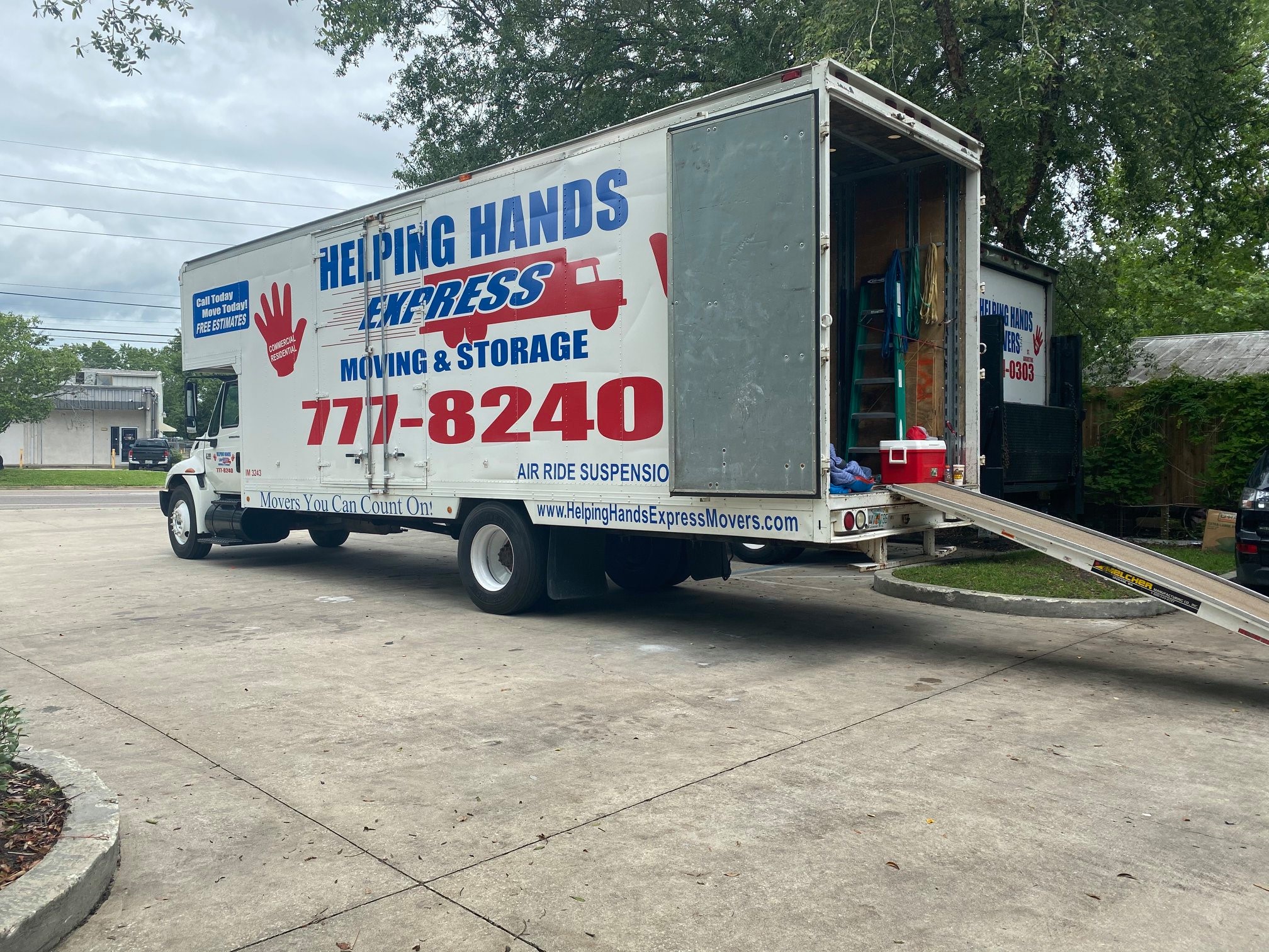 Movers 5 Long-distance movers loading a truck for an interstate move from Jacksonville, FL